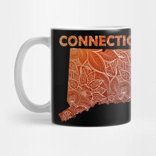 Colorful mandala art map of Connecticut with text in brown and orange Mug